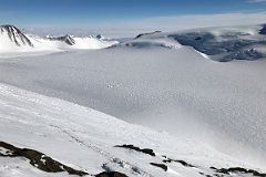 04B Looking Down At Mount Vinson Low Camp On Branscomb Glacier From Rest Stop In The Rock Band On The Climb Up The Fixed Ropes To High Camp.jpg